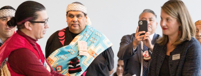 Image of council members from Musqueam Indian Band, Squamish Nation, Tsleil-Waututh Nation, and City of Vancouver, at a ceremony recognizing the passing of the UNDRIP strategy